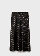 Falda midi negra con estampado de lunares color dorado.