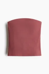 Top strapless color ladrillo, de punto acanalado de algodón y corte recto.