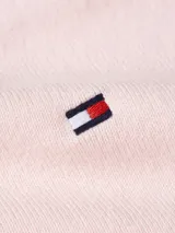 Sweater Tommy Hilfiger de punto color rosa claro, con cuello en V y logo bordado en el pecho.