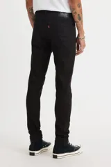 Jean skinny negro de tiro medio, con corte ajustado y sin elasticidad.