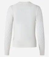 Sweater azul marino de punto con textura de ondas, cuello redondo y mangas largas.