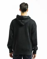 Buzo canguro verde con capucha y bolsillo frontal, de corte oversized.