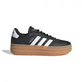 Championes urbanos Adidas VL Court Bold de mujer, color negro con las tres tiras blancas y suela marrón de plataforma.