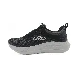 Championes deportivos Olympikus Vibe, color negro con logo blanco y suela gris.