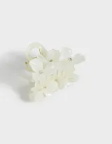 Broche para el pelo de acrílico color blanco con forma de pinza y apliques de flores con strass.