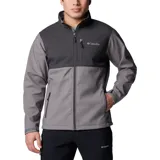 Chaqueta Columbia para hombre, modelo Ascender Soft Shell, color gris y negro. Confeccionada en tejido softshell resistente al agua y al viento. Cuenta con protector de mentón, bolsillo en el pecho con cierre, bolsillos para manos con cierre, puños ajustables y dobladillo ajustable con ceñidor.
