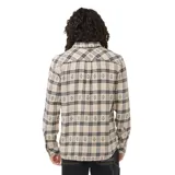 Camisa de franela a cuadros beige y negro, de manga larga, con bolsillo en el pecho y logo bordado.
