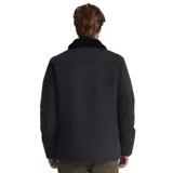 Campera negra con cuello de piel sintética, cierre con botones tipo tanca, bolsillos frontales con solapa y bolsillo vertical en el pecho. Corte recto y largo a la cadera.
