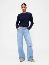 Buzo de algodón negro con cuello redondo, manga larga y tejido de punto con trenzas y calados en el frente.