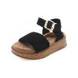 Sandalias marrones con plataforma de corcho, tira ancha sobre el empeine y pulsera al tobillo con hebilla dorada.