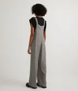 Mono largo de viscosa con estampado de cuadros, tirantes con lazo y corte palazzo.
