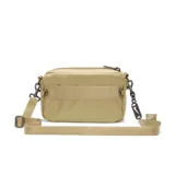 Riñonera Nike Sportswear Futura Luxe Crossbody color beige, con correa ajustable y logo de la marca en el cierre.