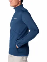 Campera polar Columbia Park View Fleece, color azul jaspeado, con cierre frontal completo, cuello alto, bolsillos laterales con cierre y bolsillo en el pecho con cierre vertical en color verde lima. Cuenta con tecnología Omni-Wick, puños elásticos con orificios para pulgares y protector de barbilla.