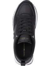 Zapatillas deportivas Tommy Hilfiger negras de cuero sintético, con cordones y suela blanca.