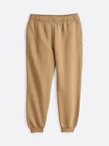 Pantalón de jogging color beige, de corte cónico y cintura elástica con cordón.