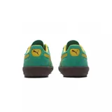 Championes Puma Palermo negros con detalles en blanco y suela color caramelo.