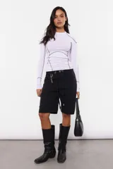 Top manga larga de morley color lila, con cuello redondo y detalle de costuras a contratono.