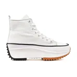 Zapatillas deportivas de caña alta color blanco con suela gruesa de goma color caramelo y detalles en negro.