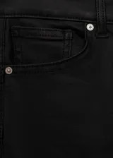 Pantalón de jean negro skinny con acabado encerado, tiro bajo, cinco bolsillos y cierre de cremallera y botón.