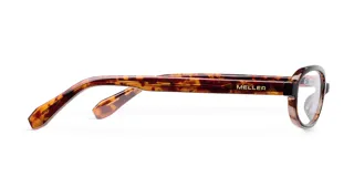 Montura de lentes para computadora con filtro de luz azul, de forma ovalada y montura gruesa con patrón carey (tortoise). Las patillas son de color blanco translúcido en la parte superior y carey en la parte inferior.