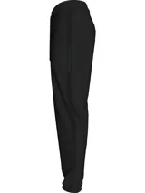 Pantalón de jogging negro con cintura y puños elásticos, cordón ajustable y bolsillos laterales. Presenta una cinta con el logo de Calvin Klein en espiga a lo largo de las piernas.