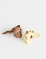 Llavero con forma de oso, disponible en color marrón y amarillo.