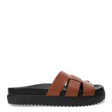 Sandalias negras de mujer, estilo slide, con plataforma gruesa y suela dentada. La capellada presenta un diseño trenzado o tejido con tiras anchas de cuero.