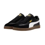 Championes Puma Club LI Era de cuero sintético negro con detalles en amarillo y suela color caramelo.