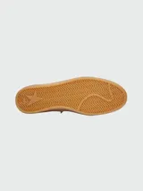 Championes Golden Goose modelo Ball Star, color blanco con detalles en verde y plateado.