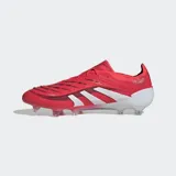 Championes de fútbol Adidas Predator Elite color rojo con detalles en blanco y suela transparente con tapones.