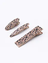 Set de tres broches para el pelo con estampado animal print.