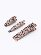 Set de tres broches para el pelo con estampado animal print.