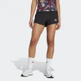 Short de running negro con logo Adidas plateado en la pierna izquierda.