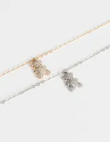 Set de dos collares cortos con dije de oso cubierto de strass, uno plateado y otro dorado.