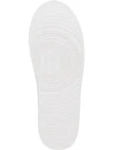Zapatillas de tenis Tommy Hilfiger de cuero blanco, con suela cupsole y logo bordado en el lateral y la parte trasera.
