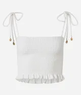 Blusa cropped color blanco, con textura de lastex, breteles finos con lazo y escote recto.