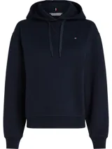 Buzo azul marino con capucha y cordón ajustable. Logo de Tommy Hilfiger bordado en el pecho. Puños y bajo de punto canalé.