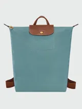 Mochila Longchamp modelo Le Pliage Original M, color crudo con detalles en cuero marrón.