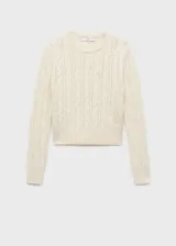 Sweater color crema de tejido de punto grueso con diseño trenzado y calado. Tiene cuello redondo y terminaciones acanaladas.