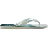 Ojotas Havaianas con base blanca estampada con palmeras y tiras verdes.