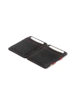 Billetera compacta de cuero negro con sistema mágico de correas elásticas para billetes y ranuras para tarjetas. Incluye protección RFID.