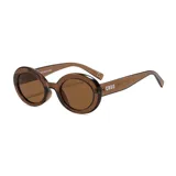 Lentes de sol CABO unisex, con montura ovalada color marrón y lentes marrones con filtro UV400. Fabricados con plástico reciclado.
