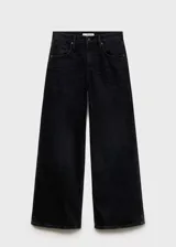 Pantalón de jean negro de corte wide leg, tiro bajo y cinco bolsillos.