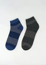 Pack de dos pares de medias tobilleras con diseño a rayas horizontales. Un par es de color azul en diferentes tonos y el otro par es de color gris en diferentes tonos.