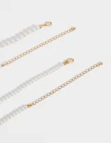 Set de dos collares de perlas blancas de diferentes largos.