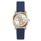 Reloj Guess Annette para mujer, con caja dorada de acero inoxidable con cristales incrustados y esfera blanca con logo 4G. Correa de silicona azul y cierre con hebilla. Resistente al agua hasta 30 metros.
