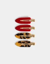 Set de cuatro hebillas para el pelo, dos de color rojo y dos con estampado carey.