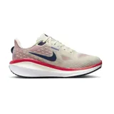 Championes de running Nike Vomero 17, color crema con detalles en azul marino y rojo.