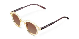 Lentes de sol unisex con armazón geométrico color amarillo claro y caramelo, y lentes polarizadas marrones con protección UV400.