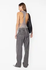 Body de tejido de punto color marrón con lurex, escote cerrado al frente y espalda cruzada semi descubierta.